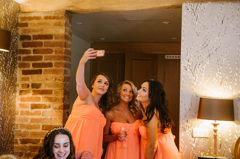 bridesmaids taking selfie before the wedding  