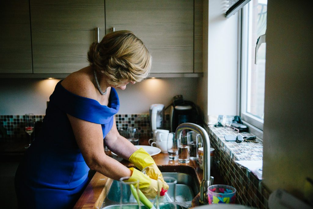 mother of bride washing up before wedding