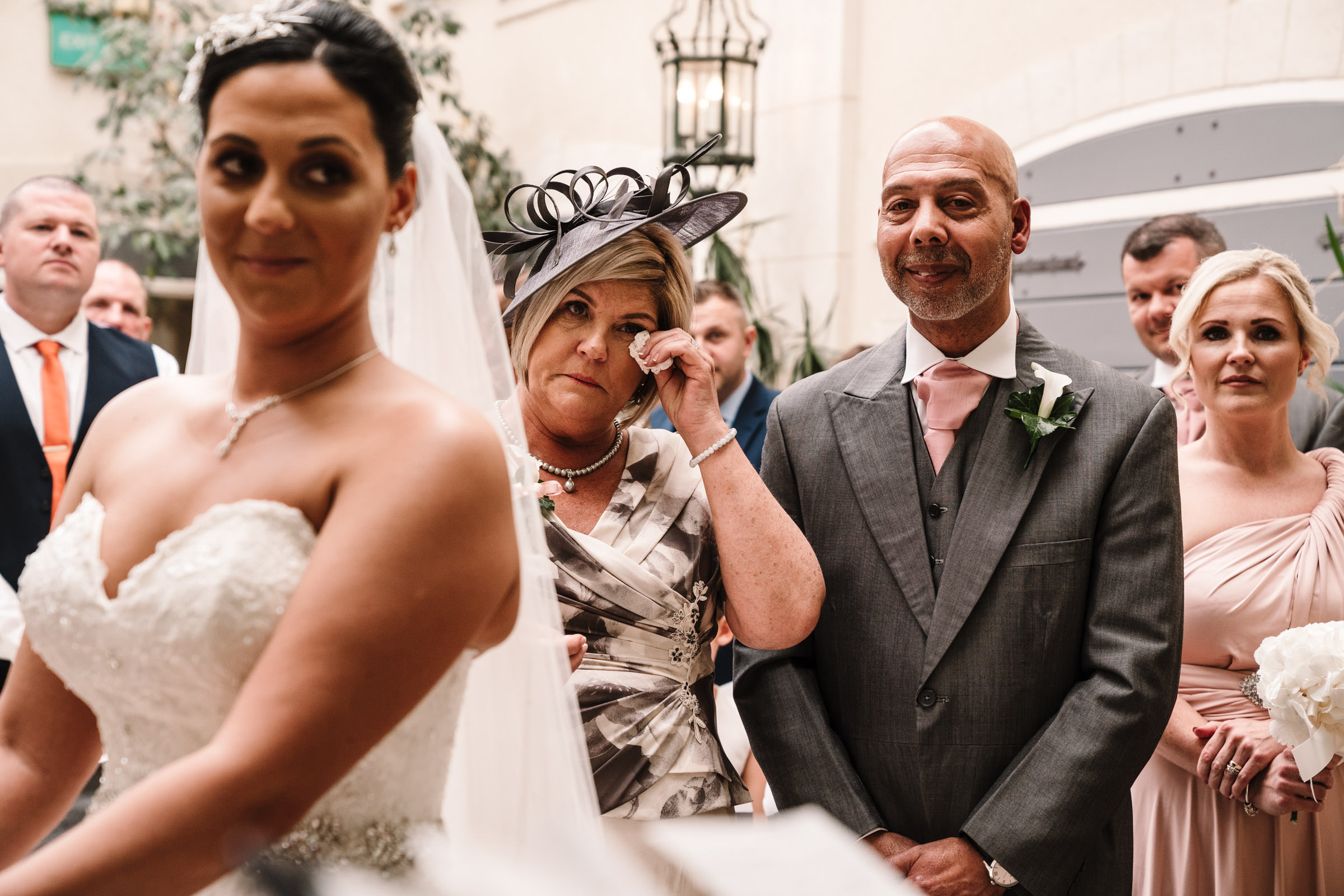 Emotional mother of the bride during nailcote hall wedding ceremony