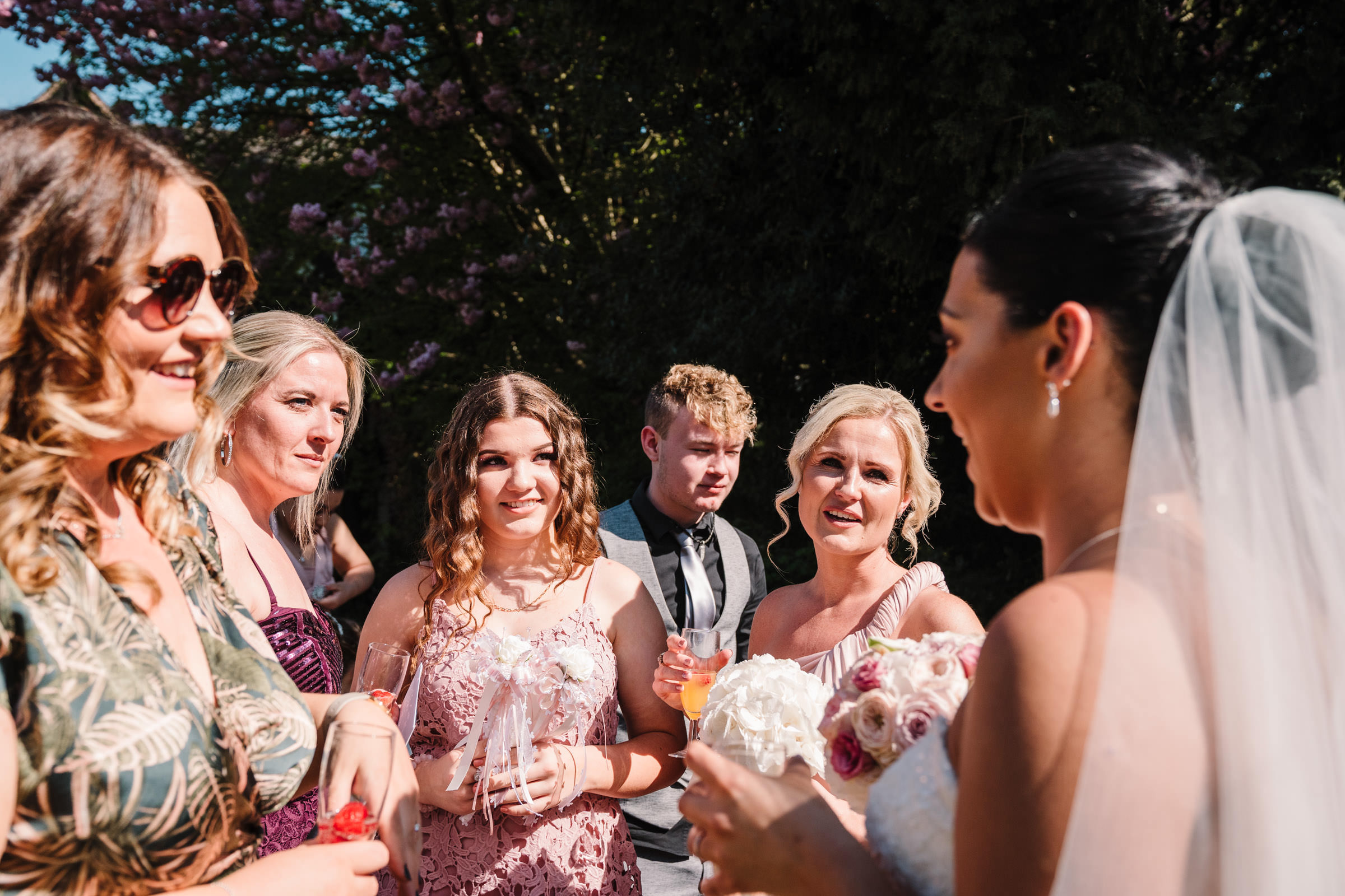 guests chatting to bride at nailcote hall wedding