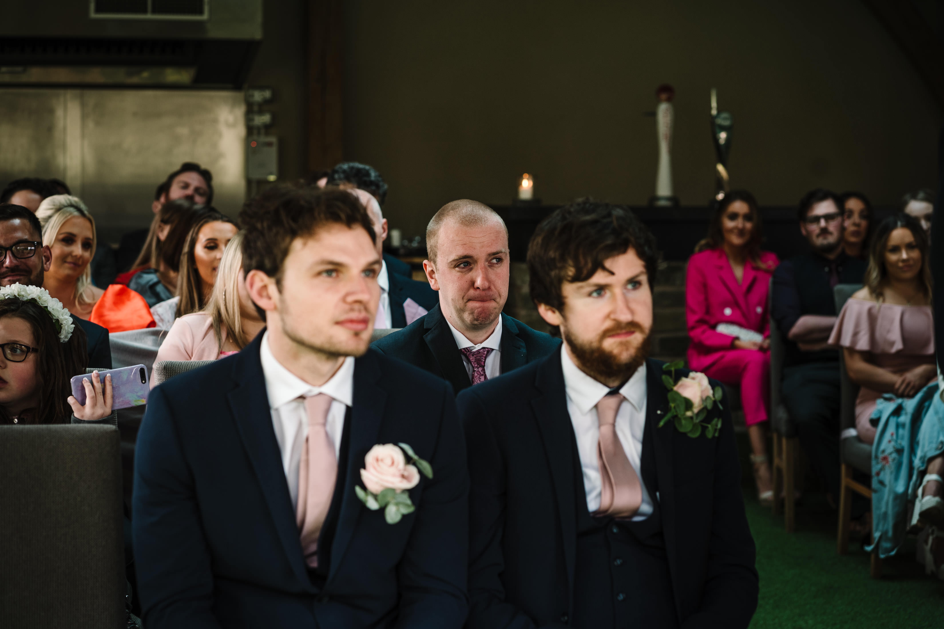 Brother of the bride emotional during wedding ceremony
