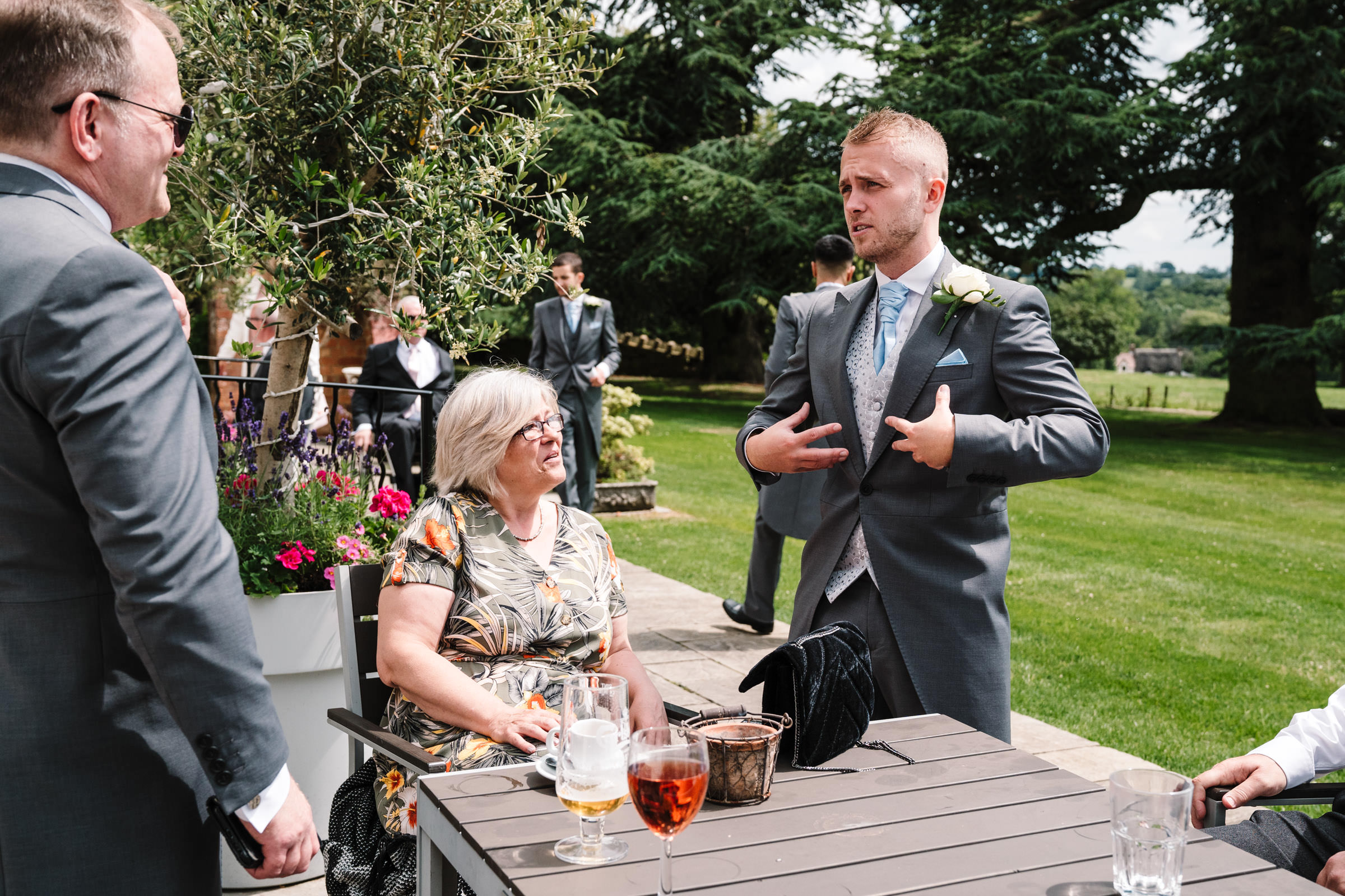 groom chatting to guests at ashton lodge