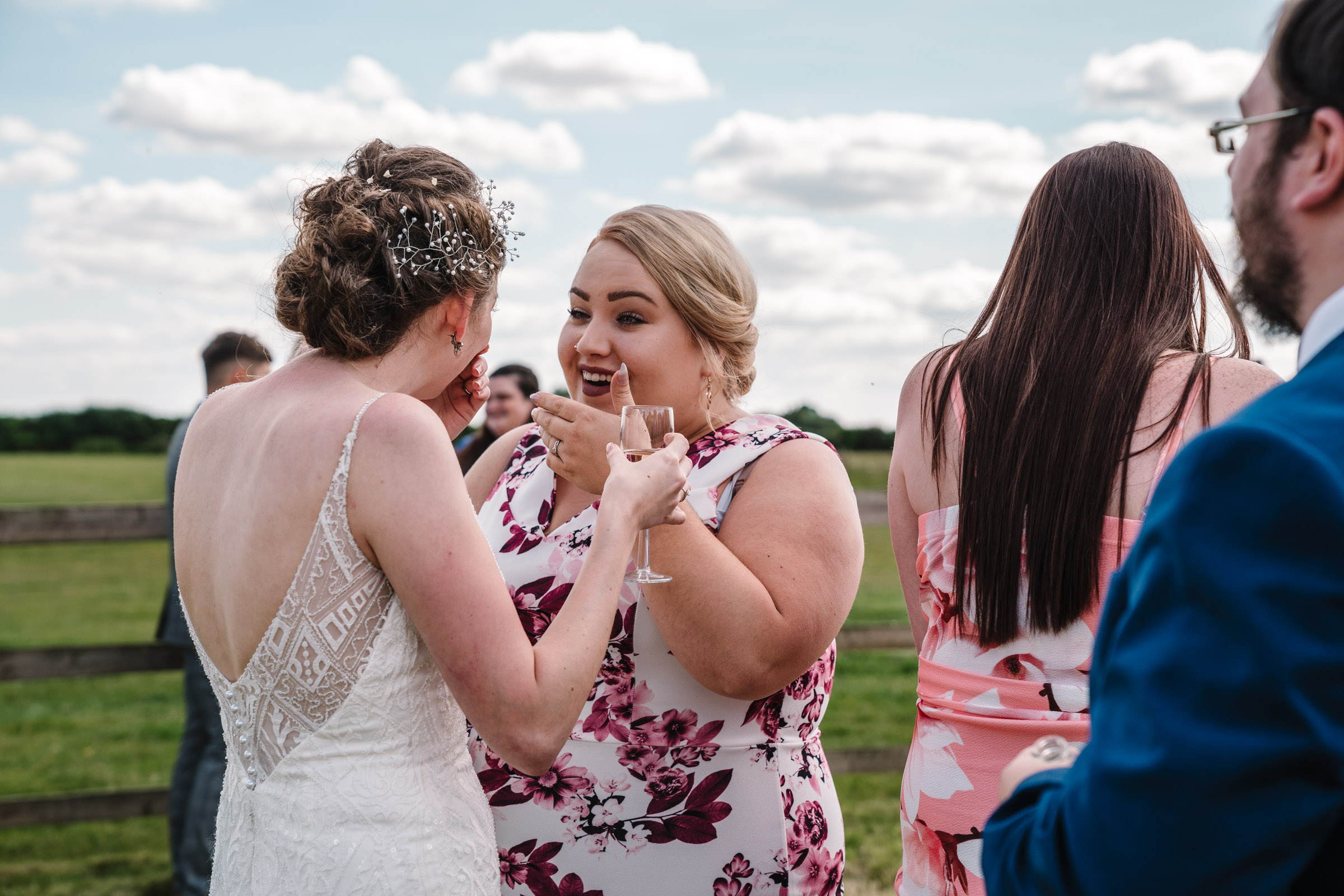 guest laughing with bride at kenilworth wedding