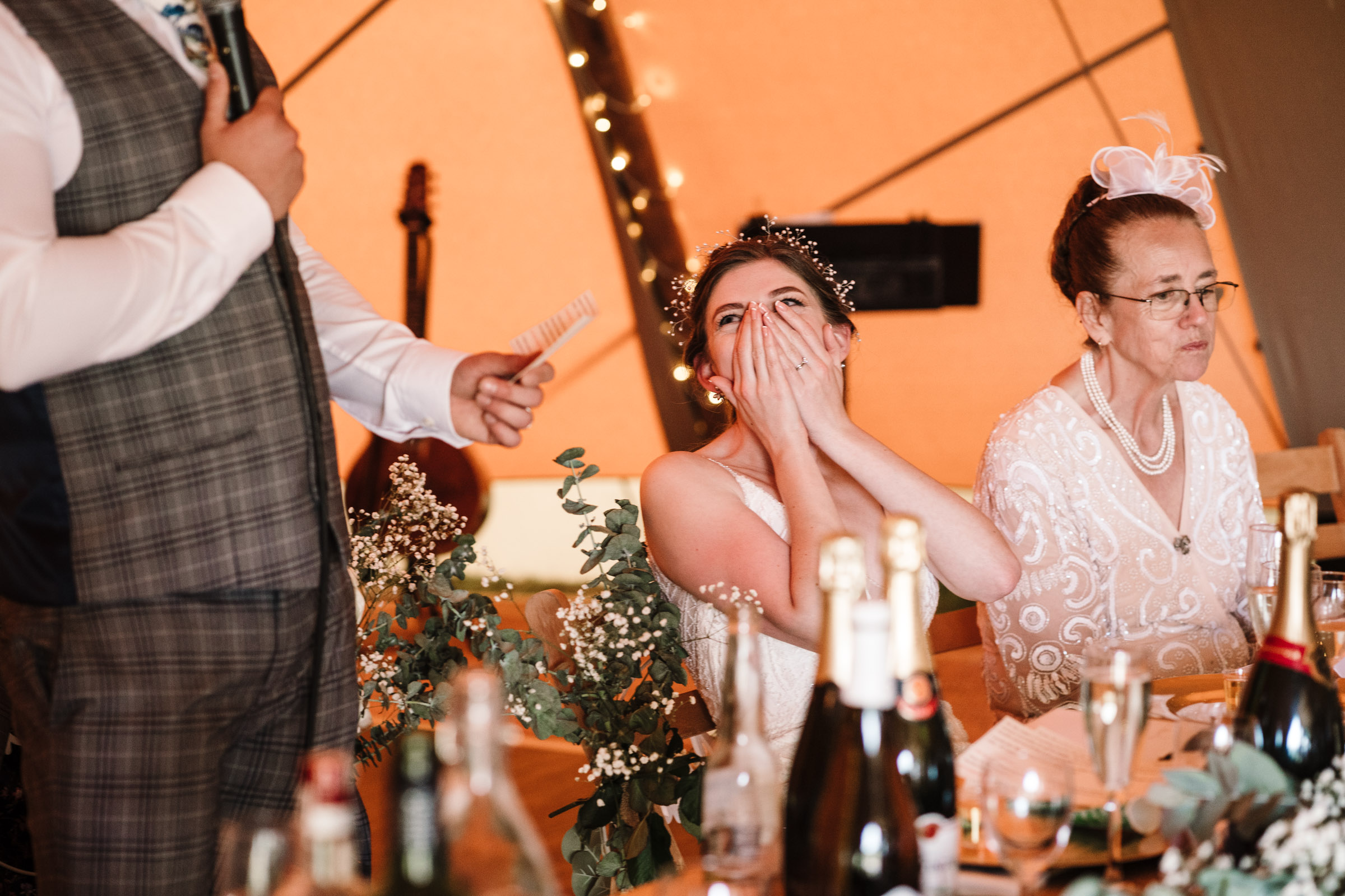 bride laughing during speeches, tipi wedding